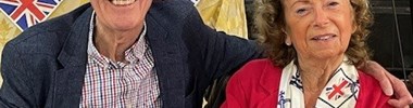 Geoff sitting with his arm around his wife Jean